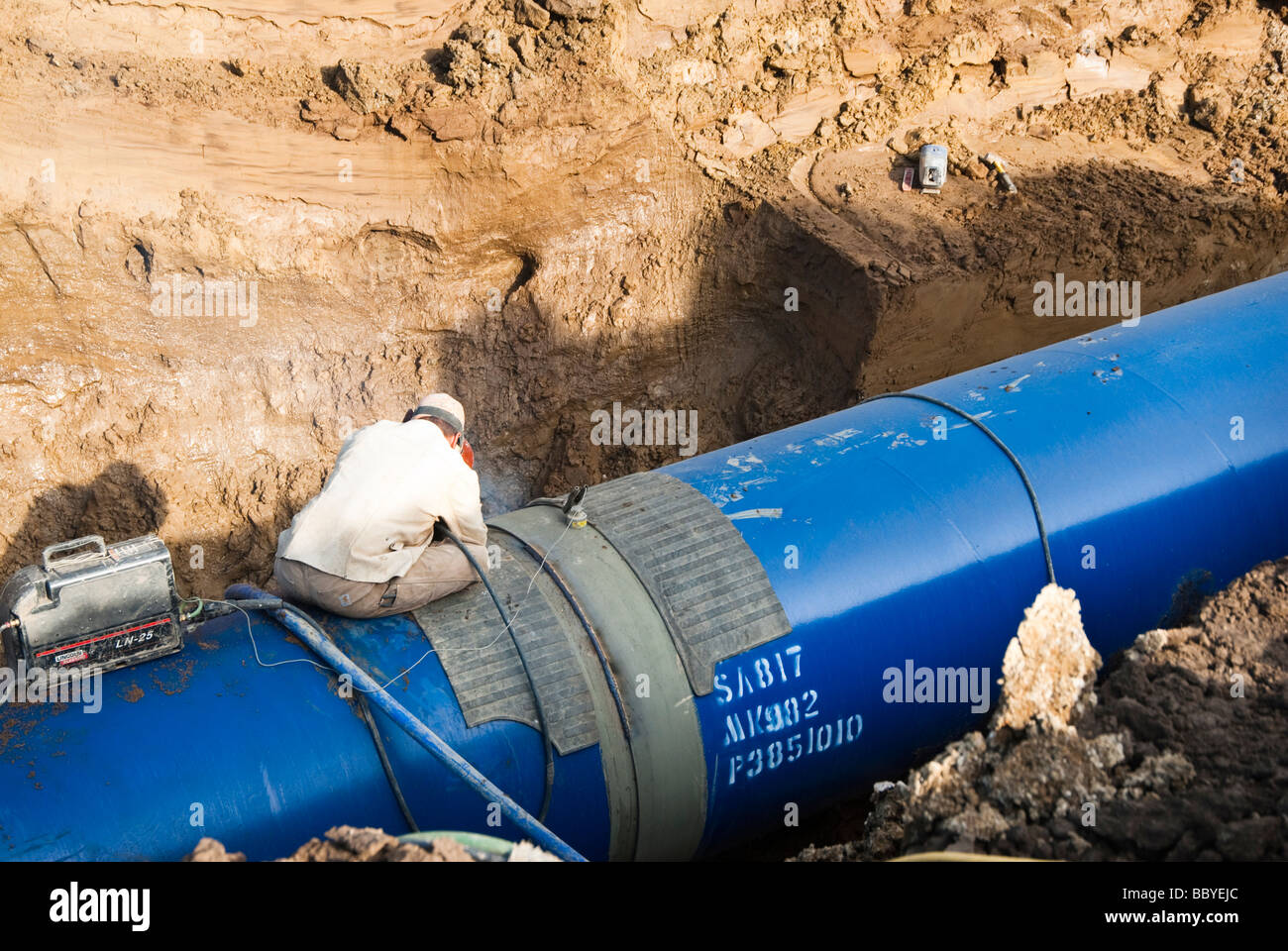 a welder working at the Louis Clark Regional Water System pipeline construction site in South