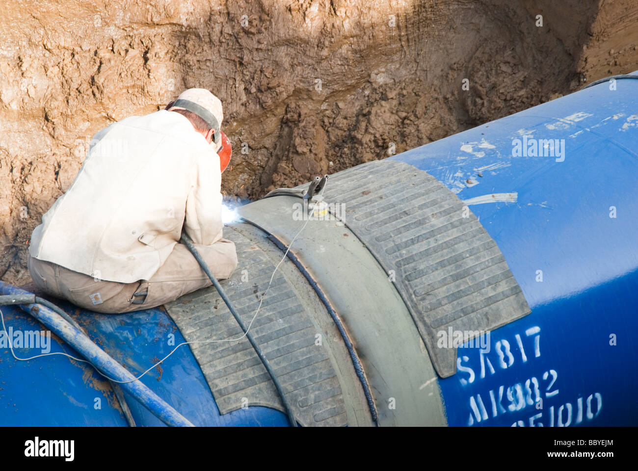 a welder working at the Louis Clark Regional Water System pipeline construction site in South