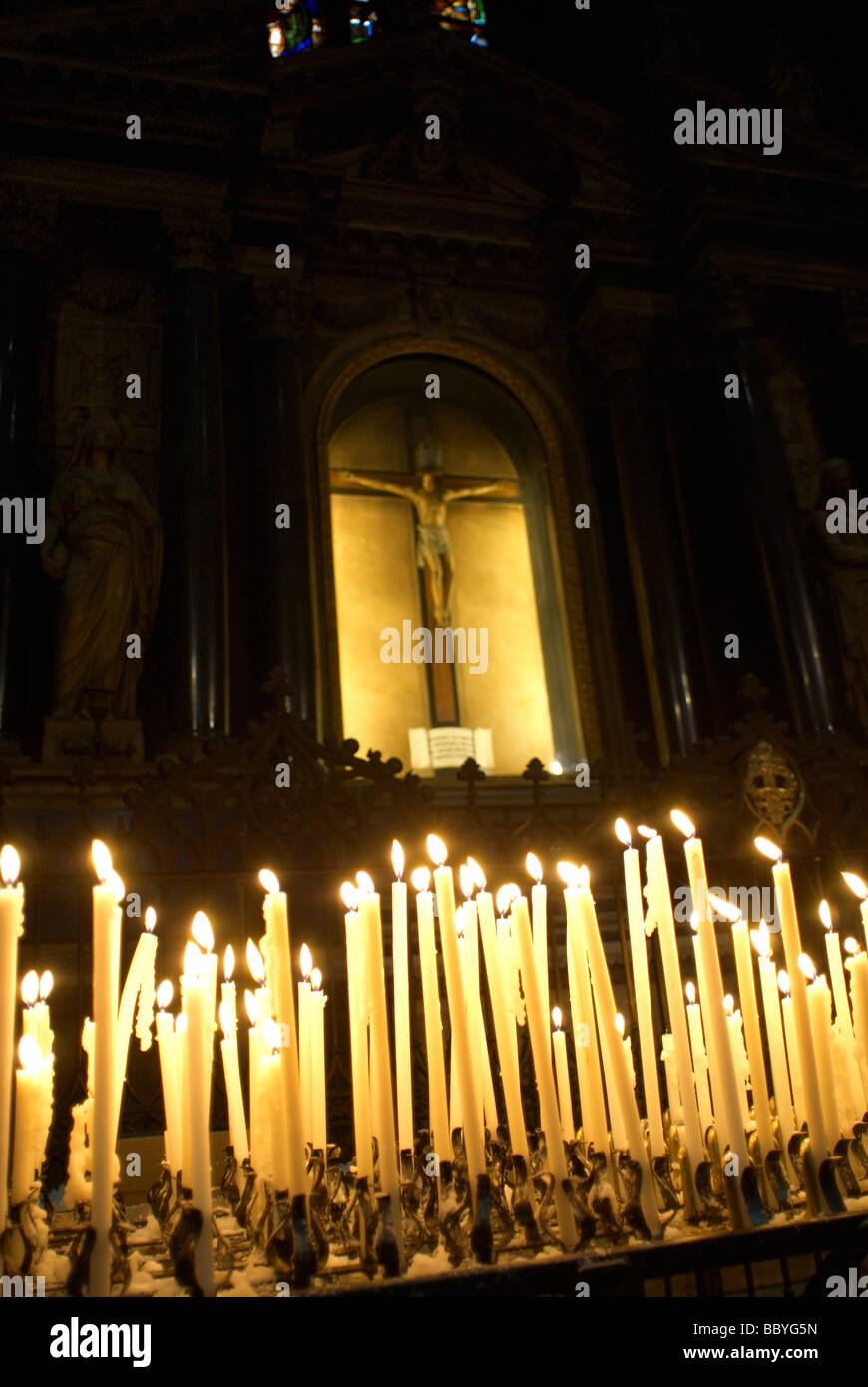 Votive candles burning in a church Stock Photo Alamy