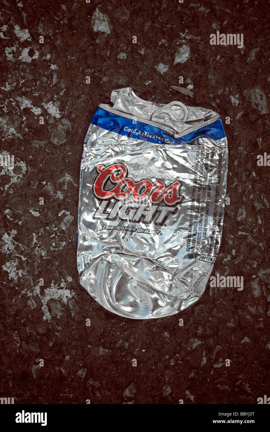 A crushed can of Coors Light beer is seen on the pavement on Sunday June 14 2009 Richard B Levine Stock Photo