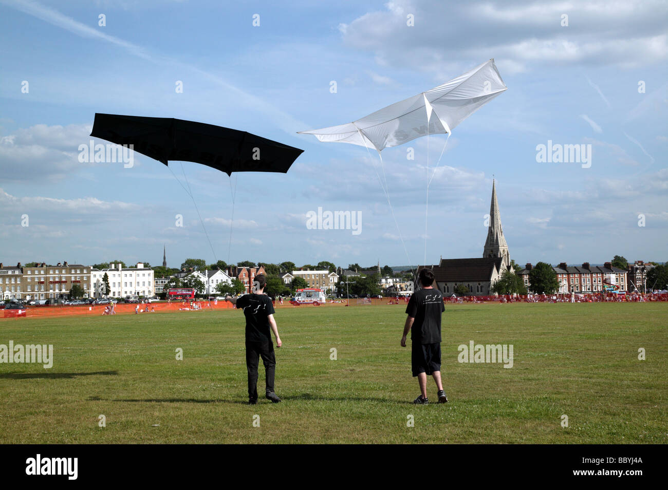 Two prize-winning competitors posing with their kites, at the end of  the Blackheath International Kite Festival 2009 Stock Photo