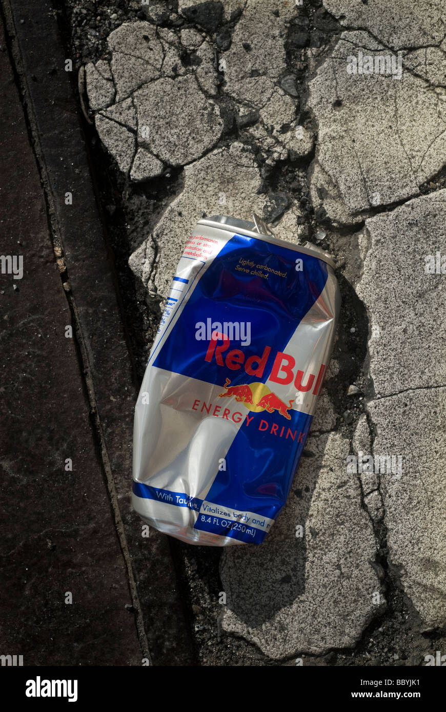 A crushed can of Red Bull energy drink seen in New York Stock Photo