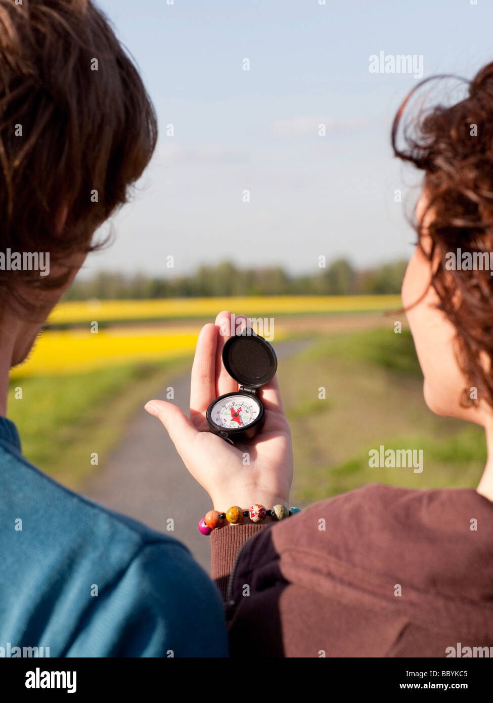 COUPLE WITH COMPASS Stock Photo