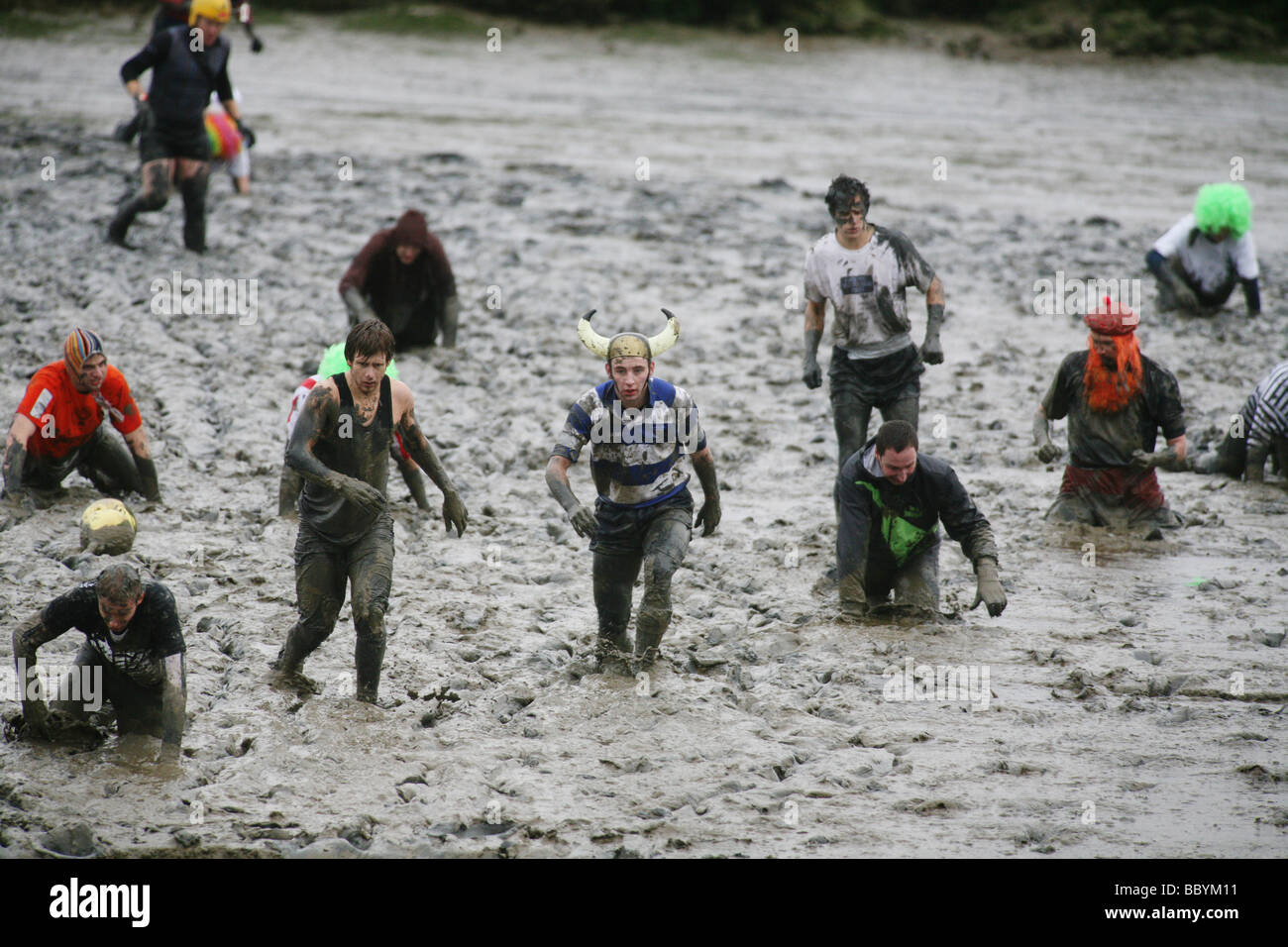 The Mad Maldon Mud Race held in the river Blackwater at Maldon Essex ...