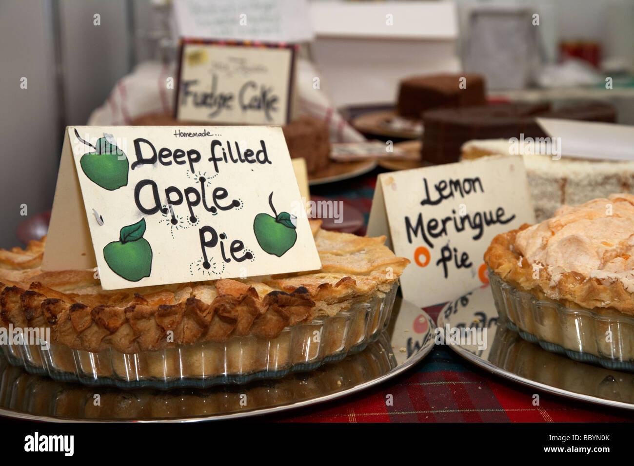 deep filled home made apple pie on a cake stall at a farmers market in