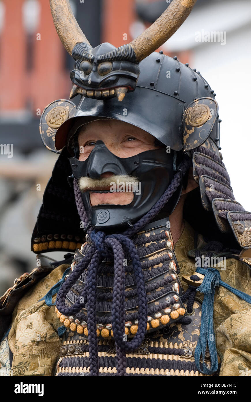 Man dressed in full samurai armor complete with kabuto helmet and mempo  face mask to intimidate the enemy Stock Photo - Alamy