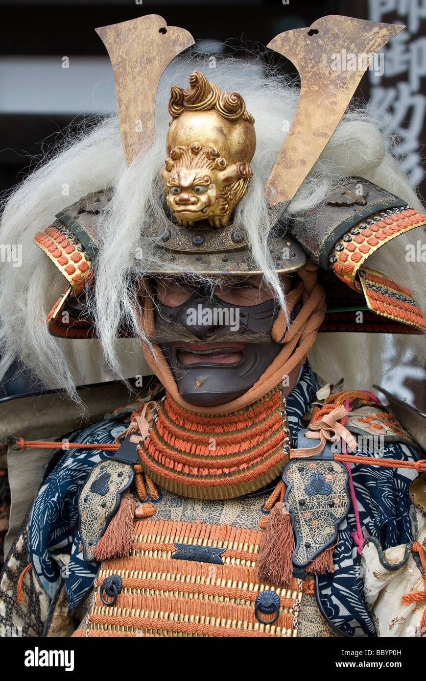 Man dressed in full samurai armor complete with kabuto helmet and mempo face  mask to intimidate the enemy Stock Photo - Alamy