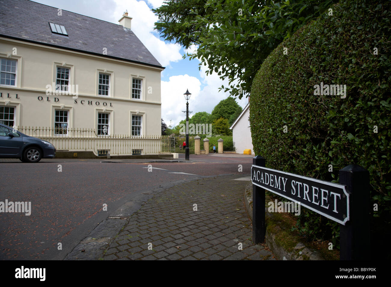 academy street sign and old schoolhouse 18th century gracehill village a moravian settlement in county antrim northern ireland Stock Photo