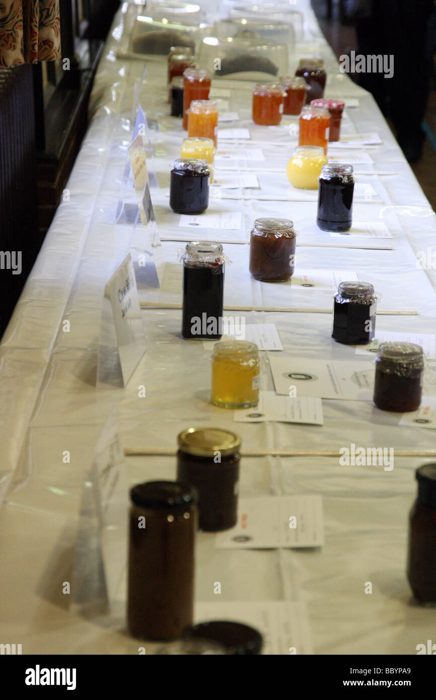 Jam, chutneys, honey and marmalade positioend on table for judging in