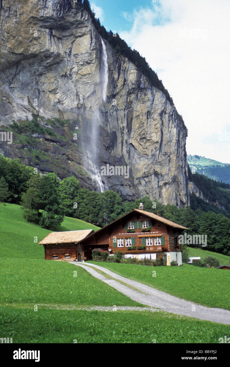 Swiss Switzerland farm green grass waterfall cliff rustic scene cow barn  house nature natural beauty beautiful fresh clean trave Stock Photo - Alamy