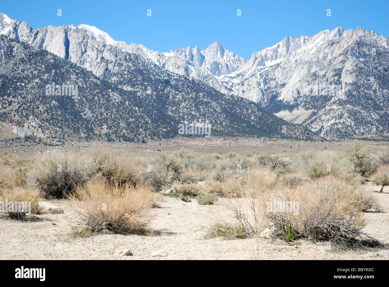 Mt Whitney the rocky peak in the center from the Mojave desert near the town of Lone Pine in the Owens Valley CA USA Stock Photo