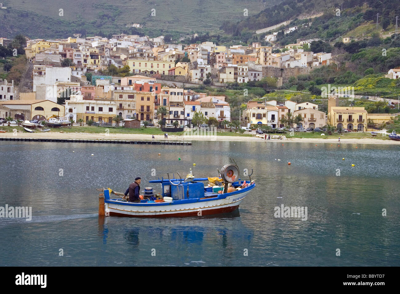 Fisherman and fishing boat at harbor Castellammare del Golfo, Sicily, Italy, Europe Stock Photo