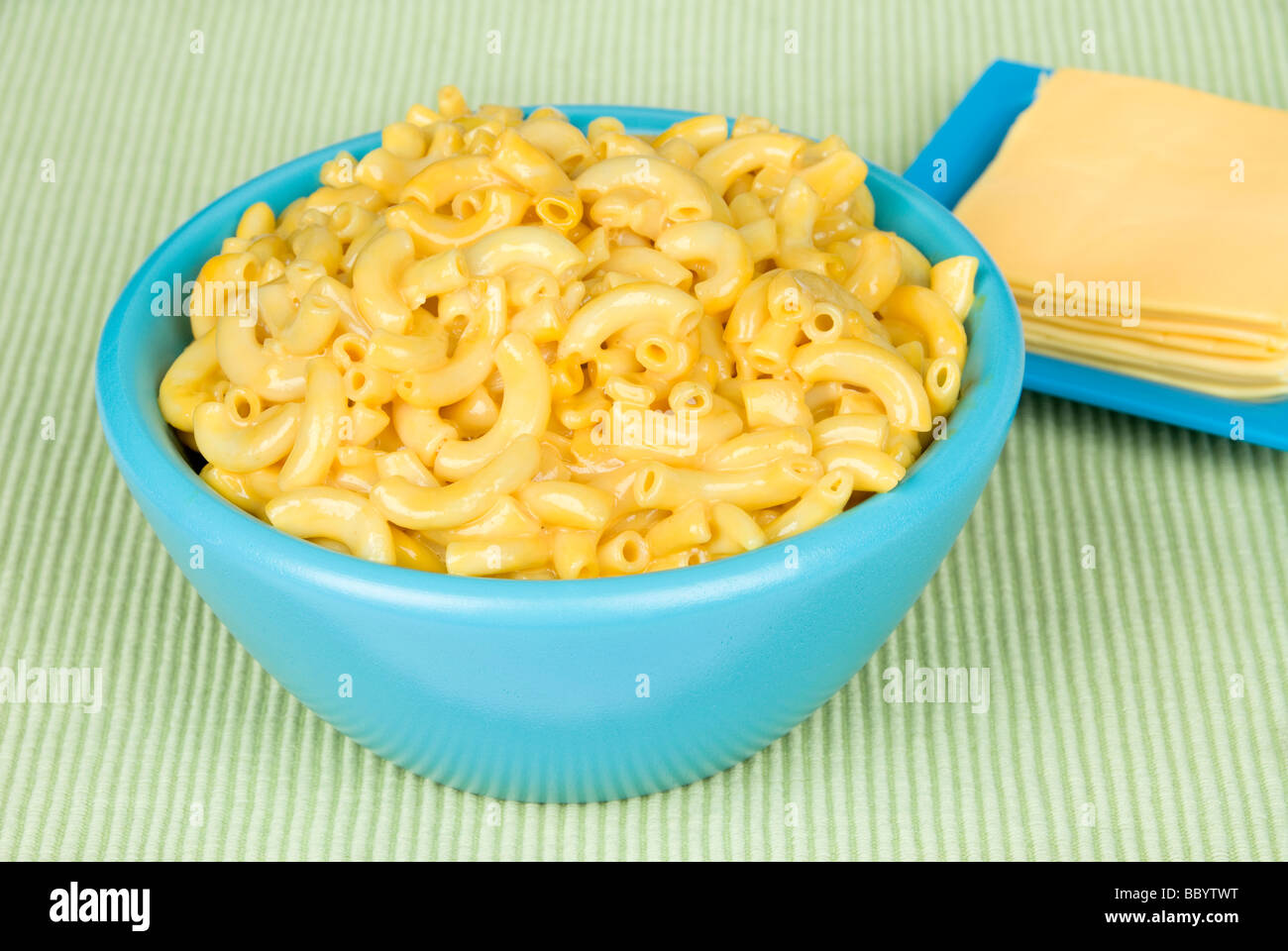 A bowl of hot macaroni and cheese with American cheese slices Stock Photo