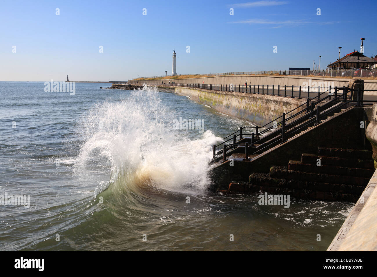 Waves breaking over steps at Roker, Sunderland, England, UK Stock Photo