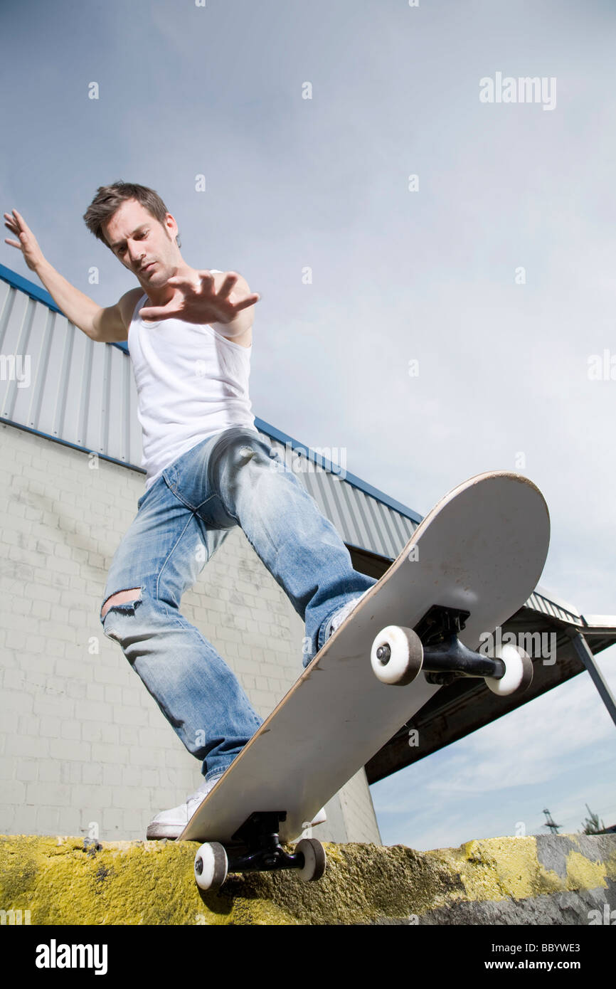 Skateboarder doing a slide Stock Photo Alamy