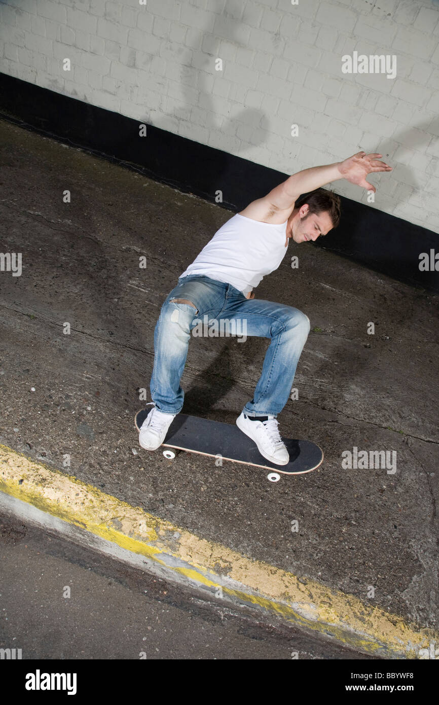Skateboarder doing a slide Stock Photo