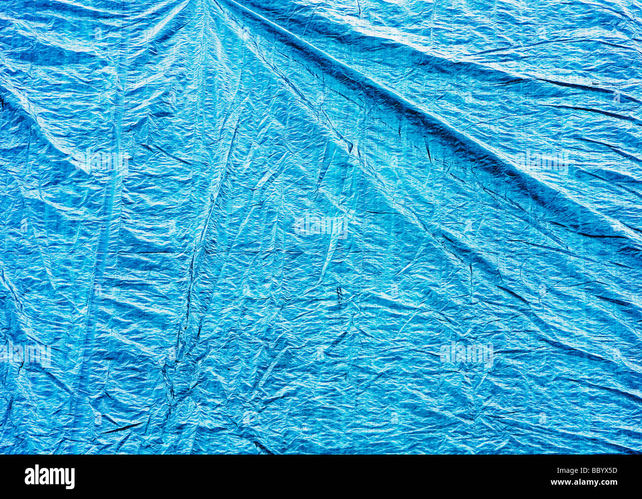 blue tarp hanging at construction site Stock Photo Alamy