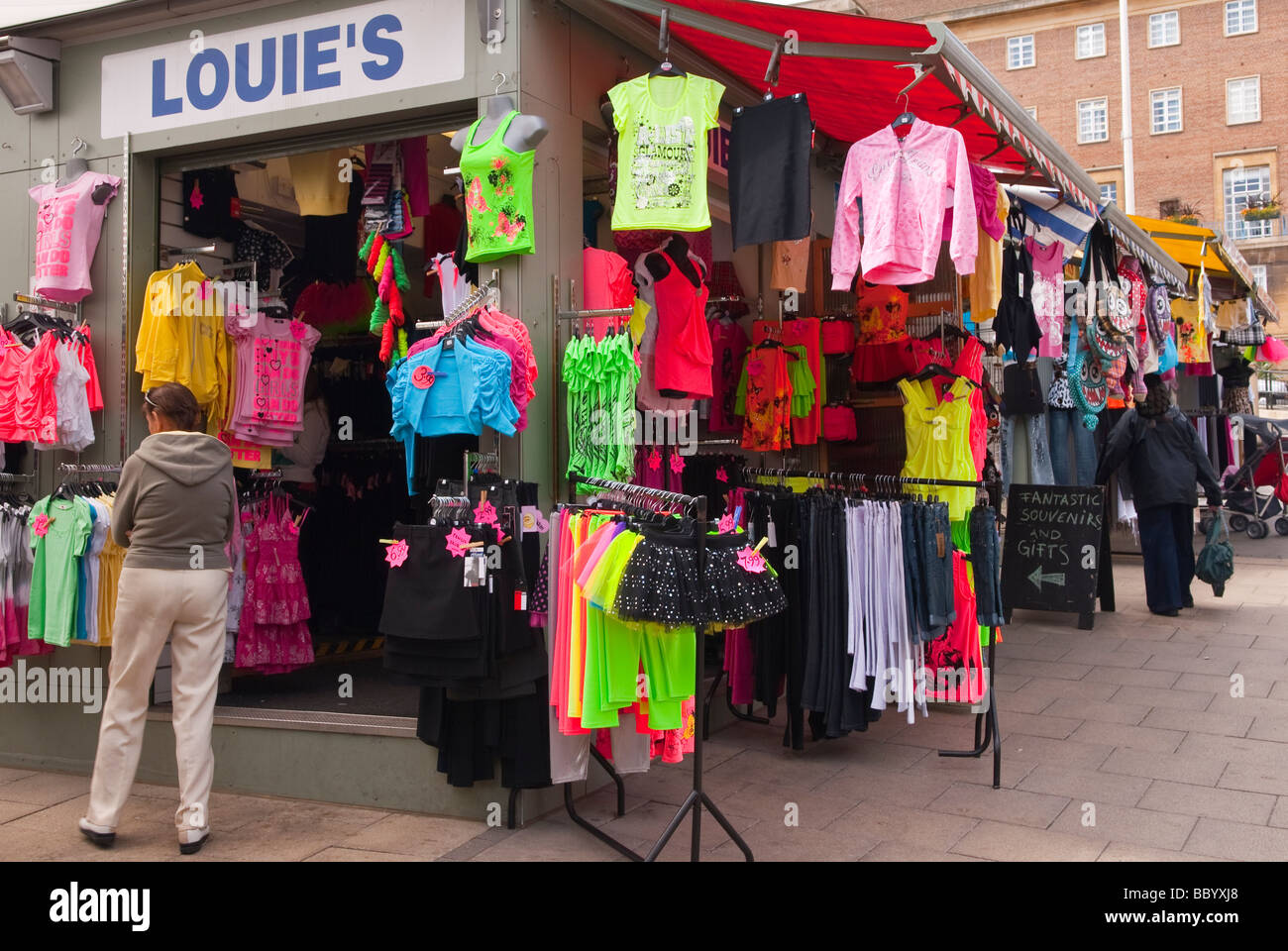 Brightly coloured fluorescent clothes for sale on an outdoor market