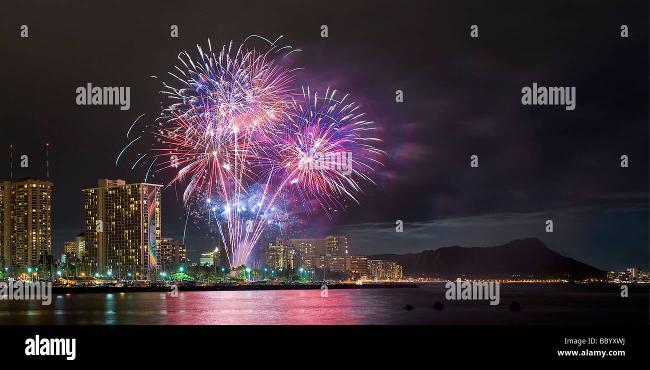 Fireworks garnish the Waikiki night skyline, Honolulu, Hawaii Stock