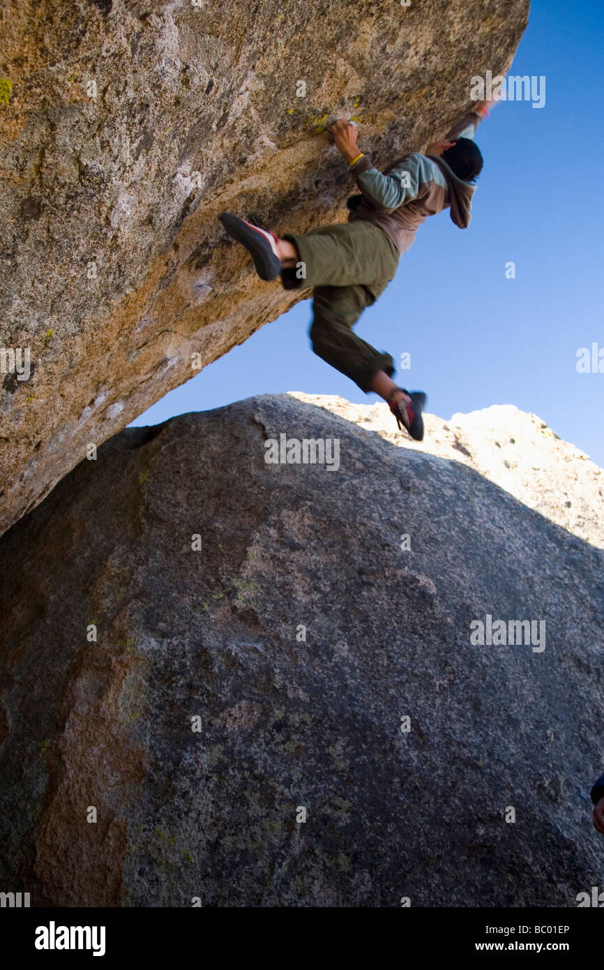 A man bouldering in the Buttermilks. Stock Photo