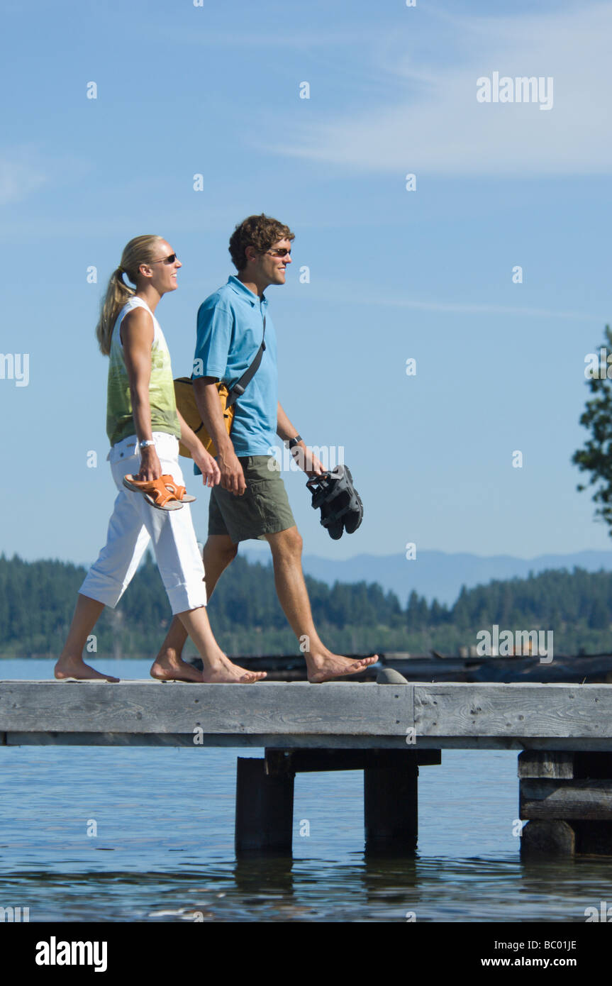 Young twenty somethings enjoy a day by the lake. Stock Photo