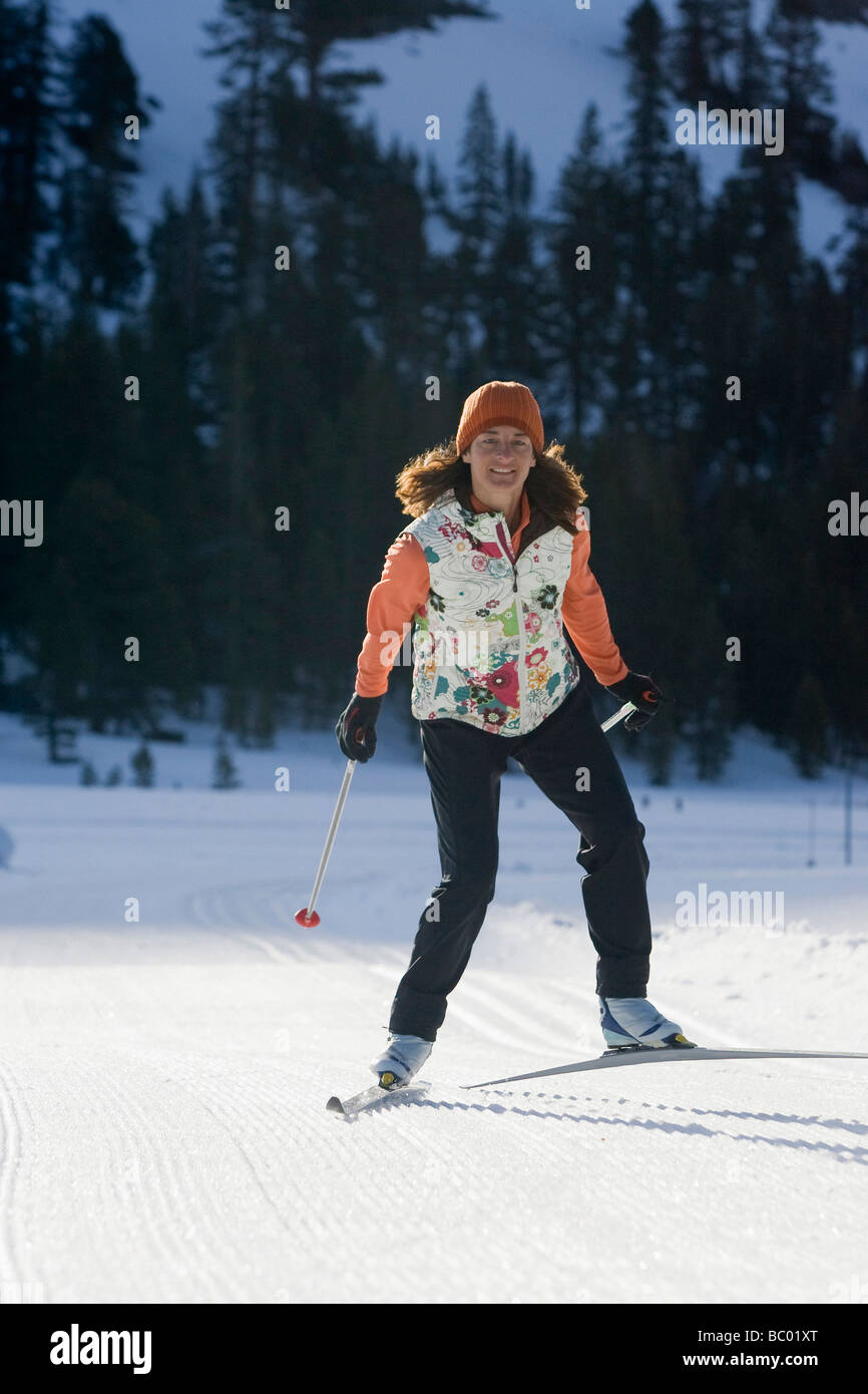 Woman cross country skate skiing in Kirkwood, California Stock Photo