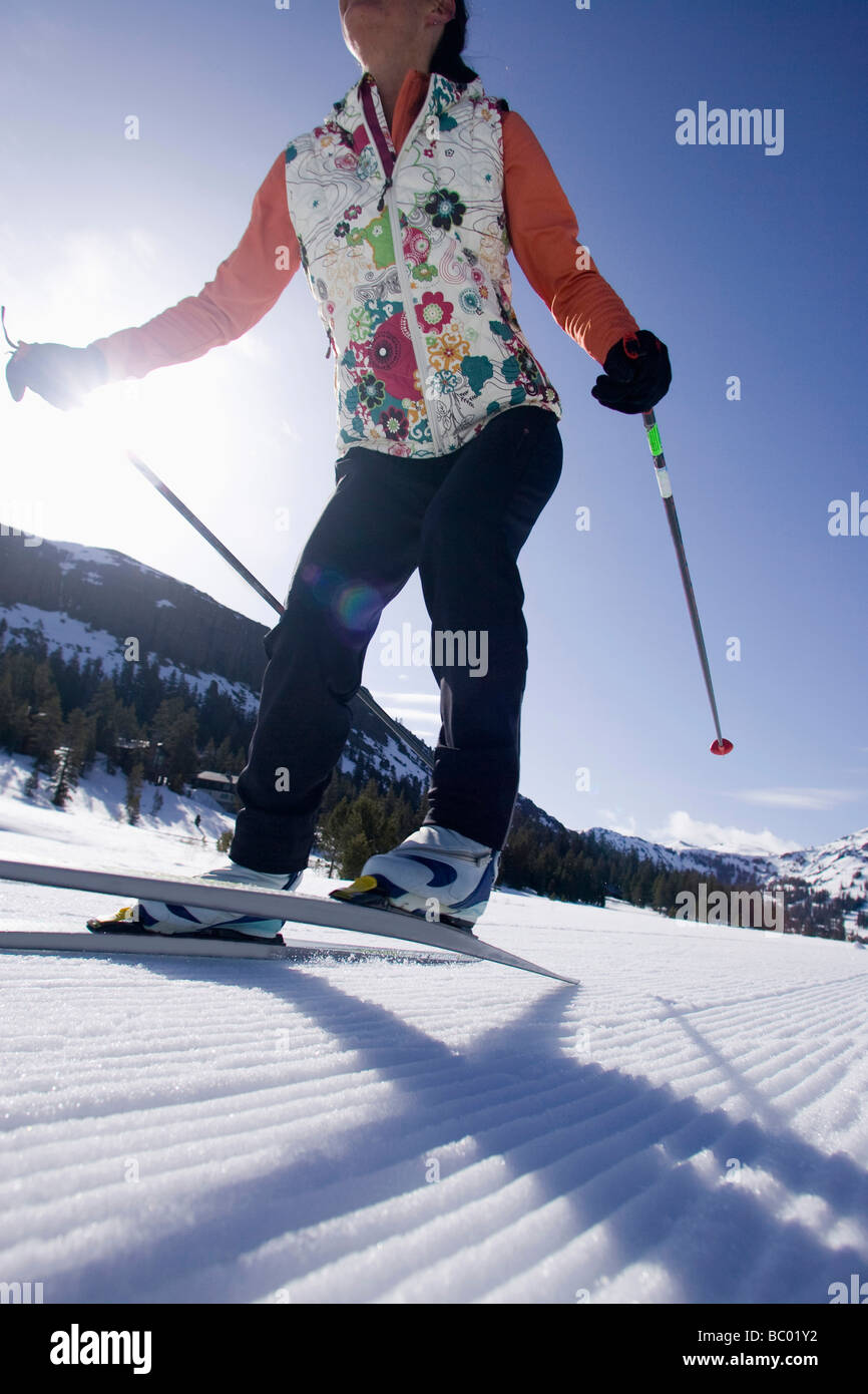 Woman cross country skate skiing in Kirkwood, California Stock Photo