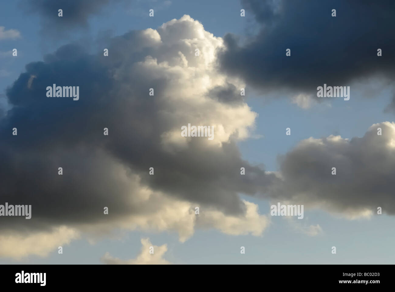 Dark clouds in the sunset blue sky Stock Photo - Alamy