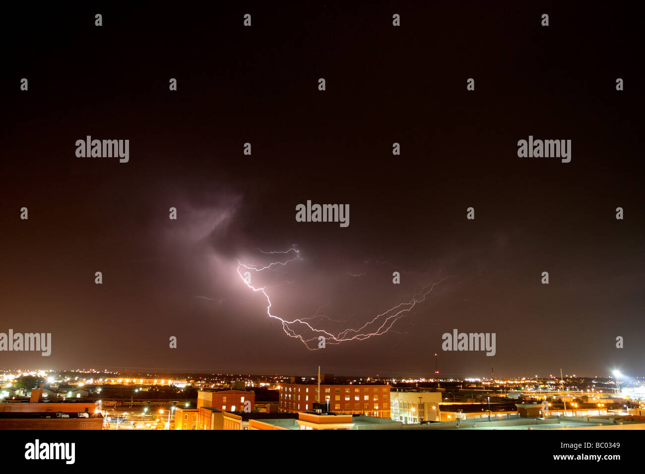 Lightning in clouds above Lincoln, Nebraska at night. Stock Photo