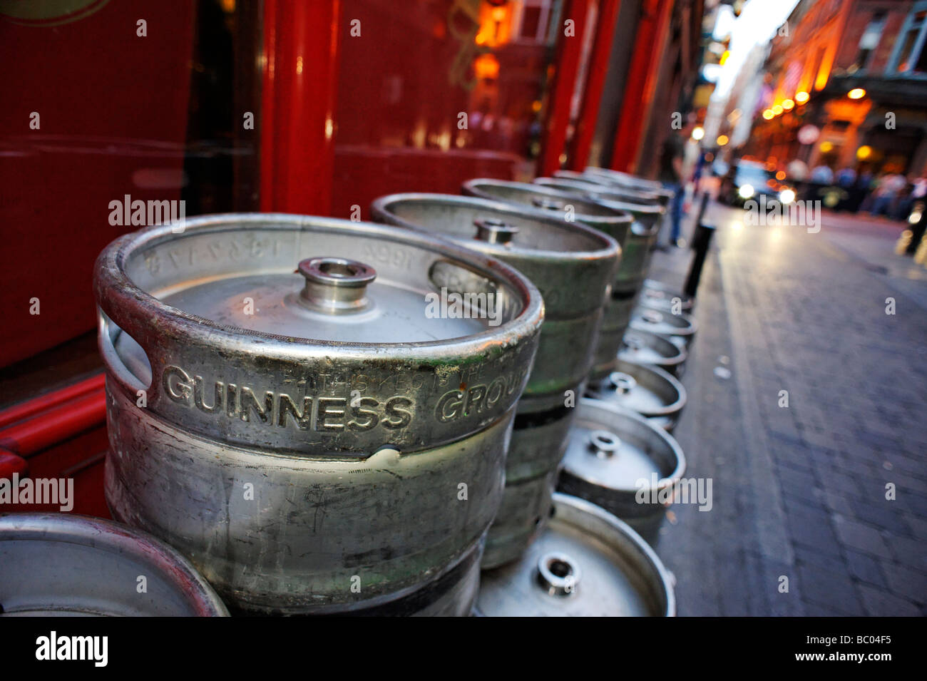 Rows of empty Guinness barrels stacked up in an alleyway outside a pub Dublin Republic of Ireland Stock Photo