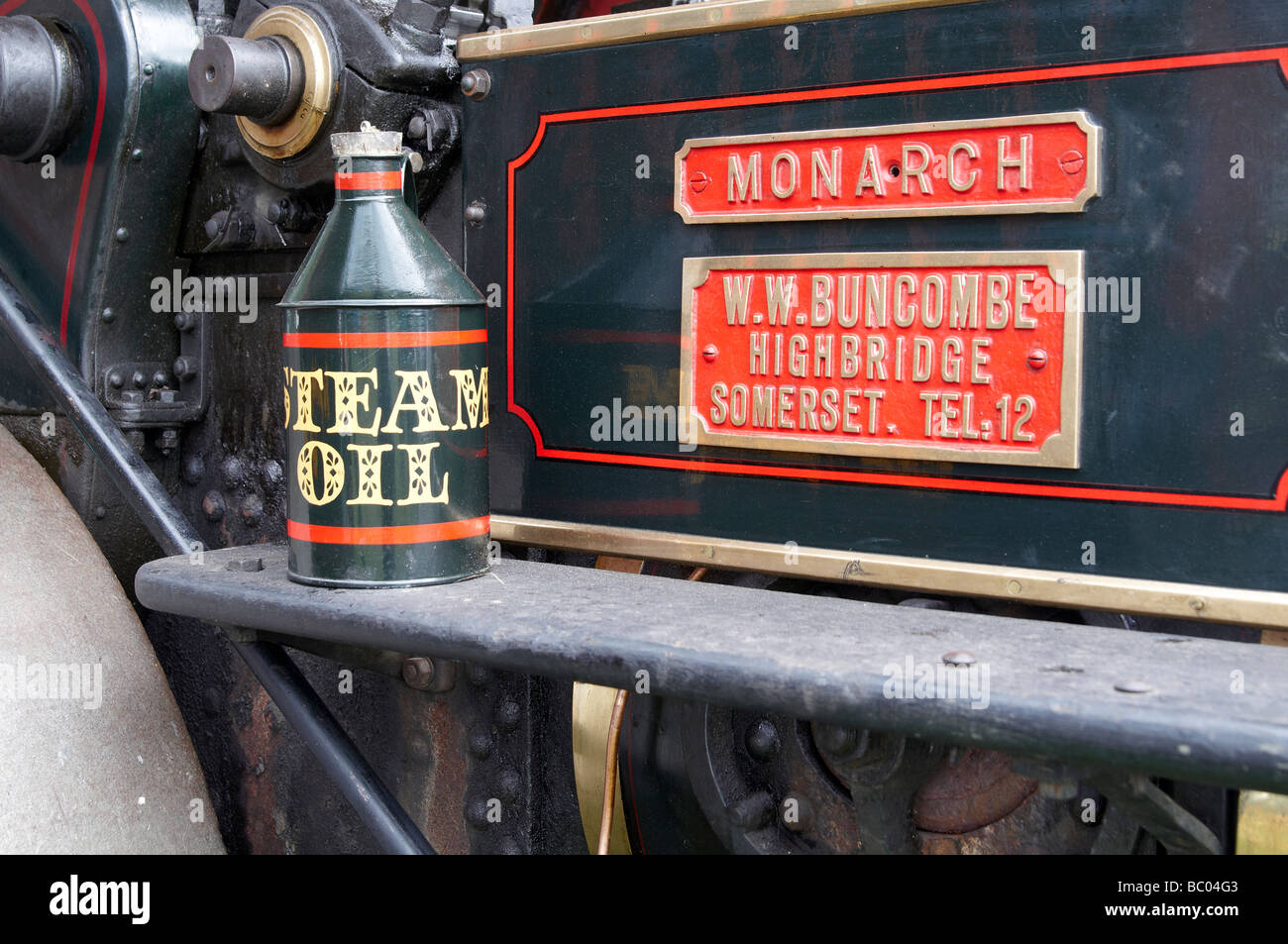Bottle of steam oil ready to lubricate steam roller Monarch at a steam rally in Hampshire, England. Stock Photo