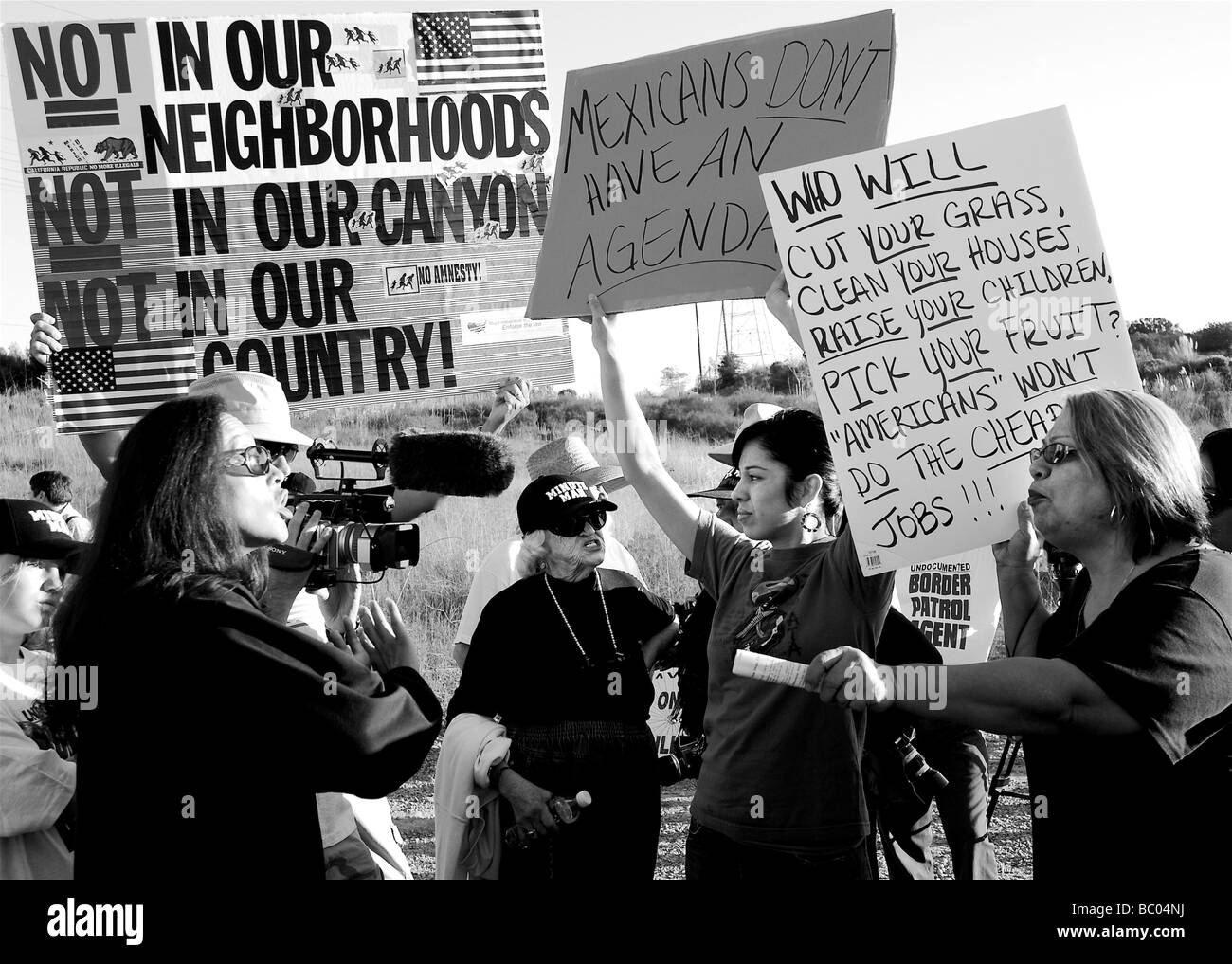 Women passionately debate the presence of illegal immigrant agricultural workers in San Diego, California. Stock Photo