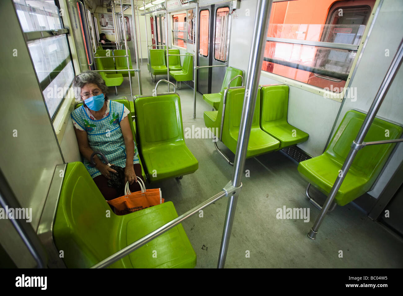 A woman travels in a lonely wagon of the subway in Mexico City, DF, Mexico. Stock Photo