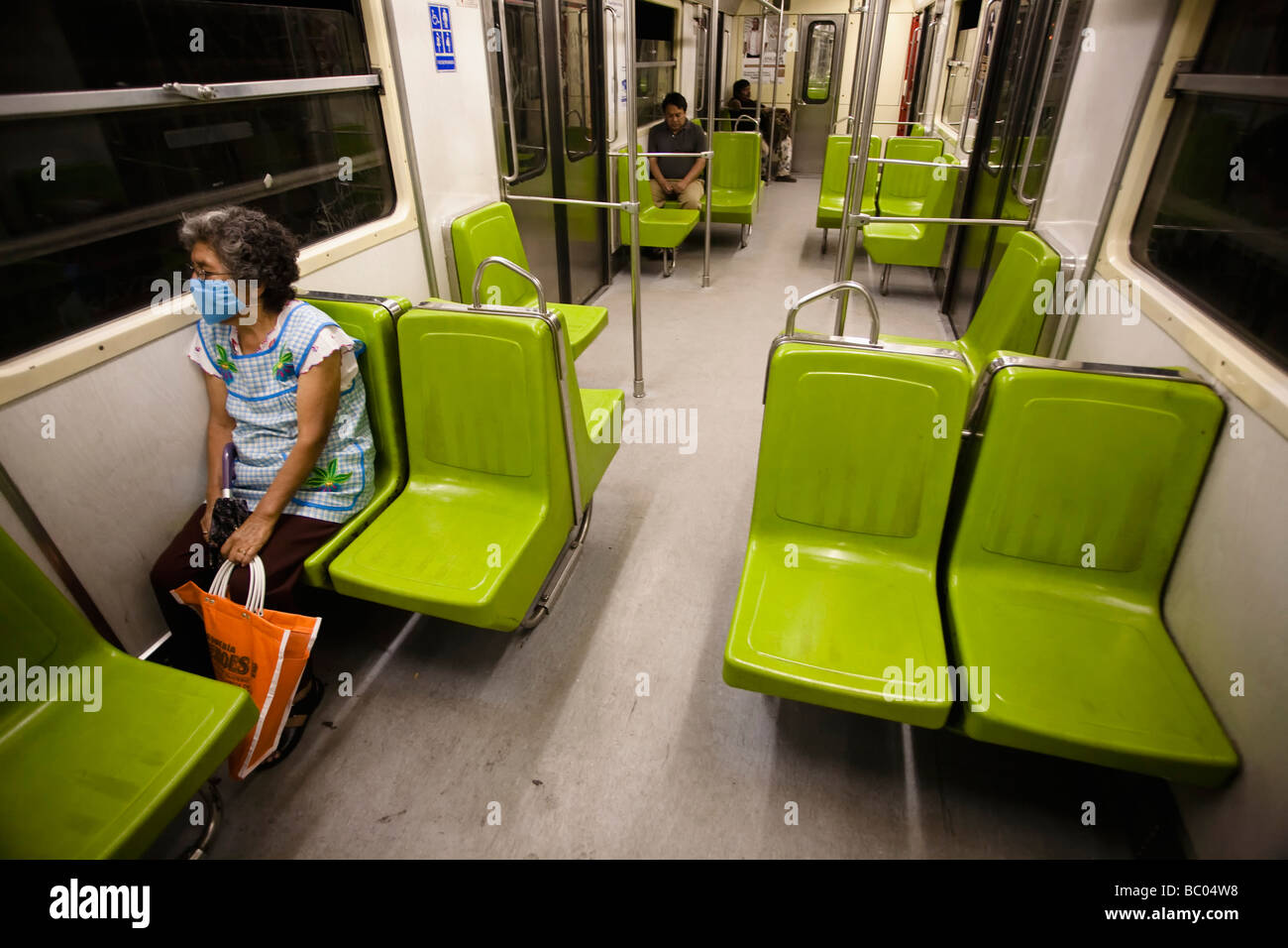 A woman travels in a lonely wagon of the subway in Mexico City, DF, Mexico. Stock Photo