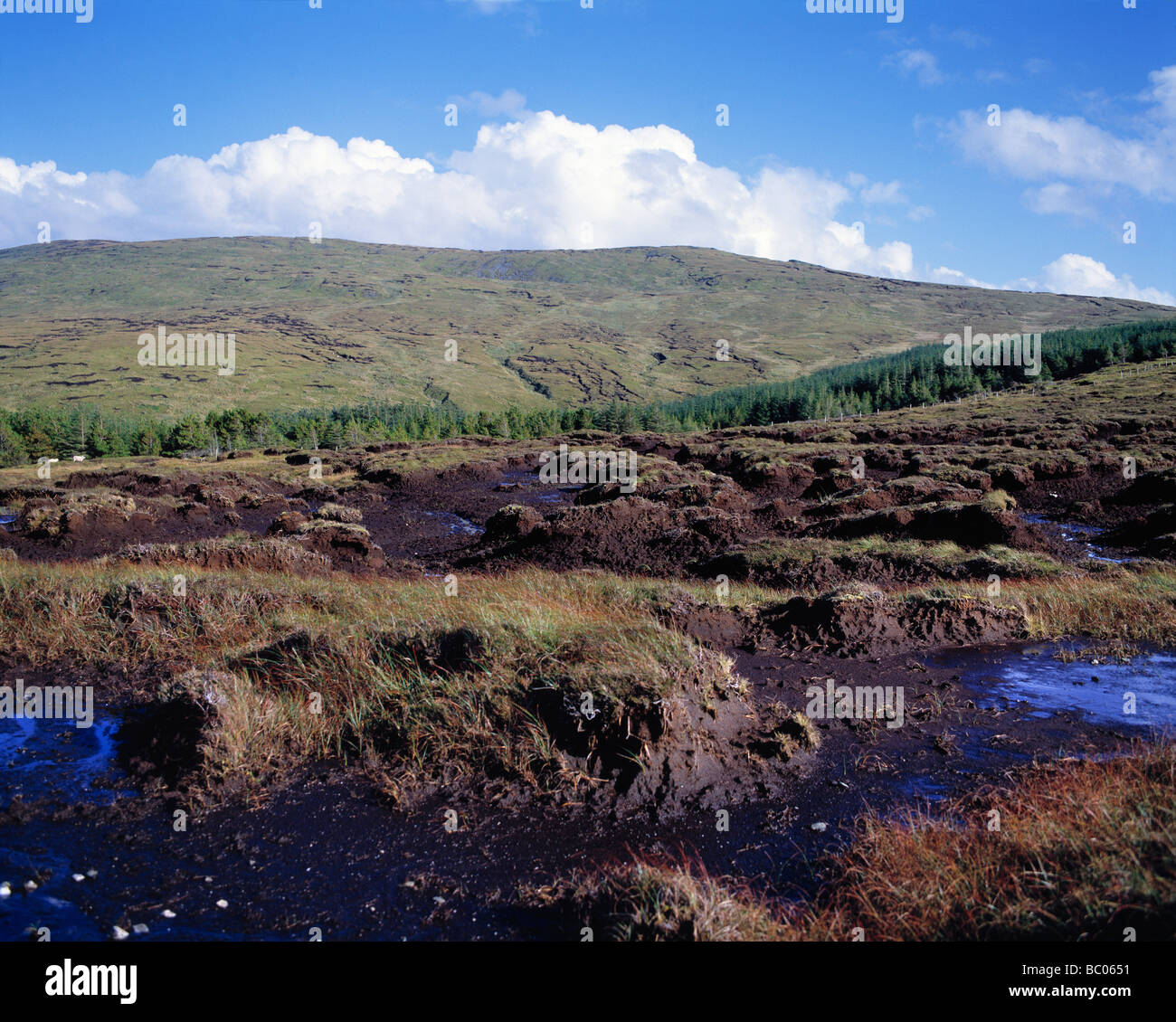 Clouds billow beyond the heathery peat bogs of Carrick County Donegal Ireland Stock Photo
