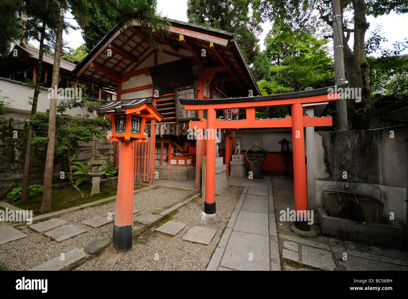 Shrine Complex Vermilion wooden torii. Small shrine at Yasaka Shinto Shrine complex ...