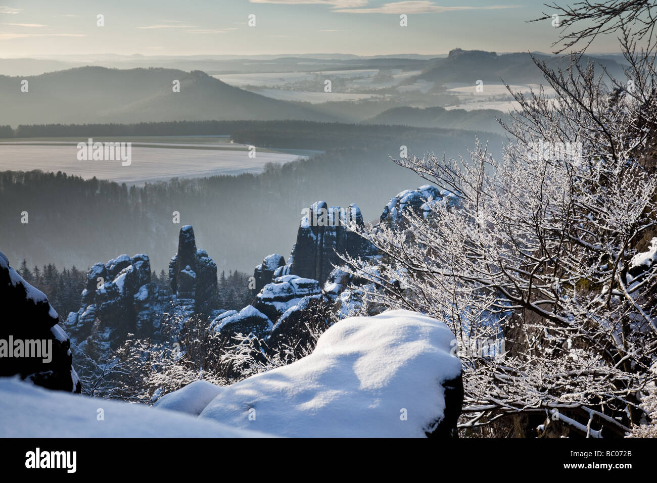 Panoramic view from Schrammsteine in national park 'Sächsische Schweiz“, Germany, into the winter scenery Stock Photo