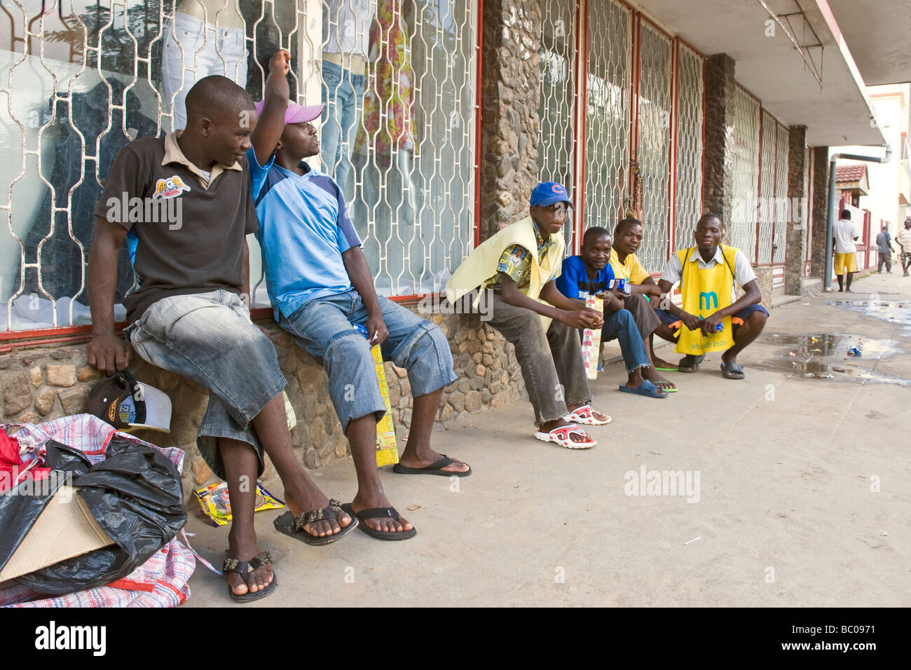 Street hawkers selling talk-time for mobile phones Quelimane Mozambique Stock Photo