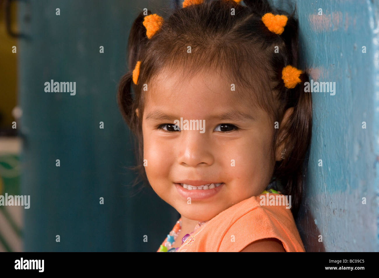 Young girl smiles for the camera. San Miguelito, Panama City, Republic of Panama, Central America Stock Photo