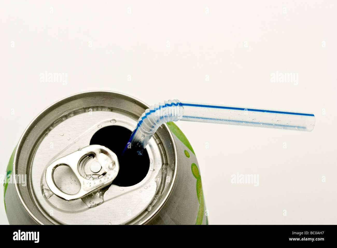 Bent plastic straw in an aluminum soda can Stock Photo Alamy