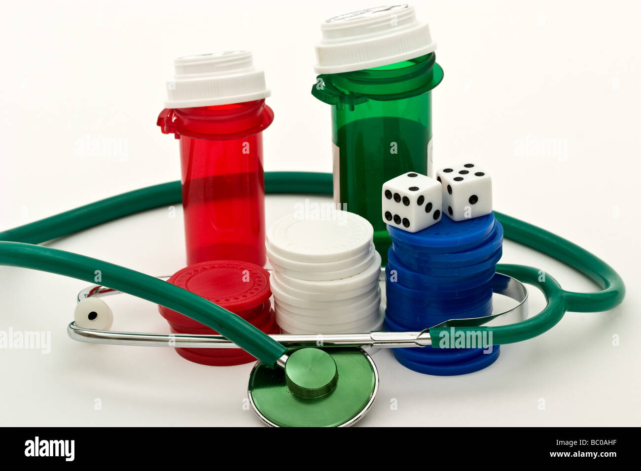 Two plastic prescription medicine containers with a stethoscope, three