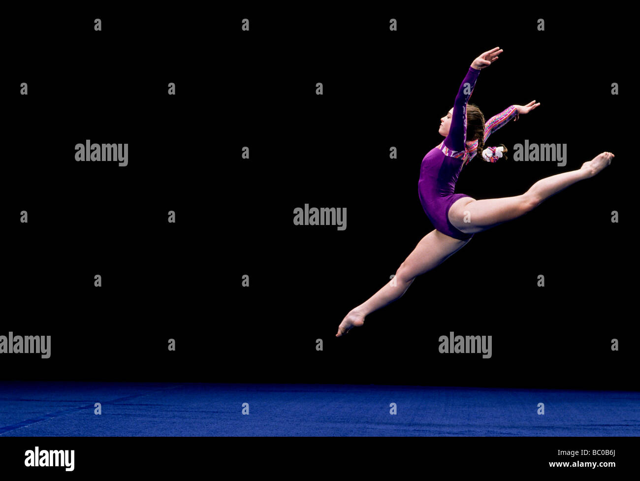 Female Gymnast Performing On The Floor Exercise Stock Photo - Alamy