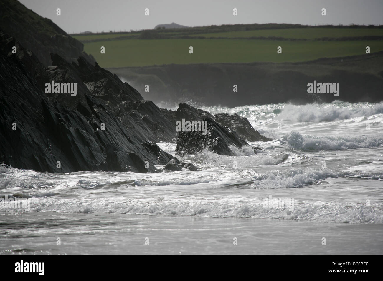 Area of Whitesands Bay, Wales. Semi silhouetted view from Whitesands Bay of the Pembrokeshire coastline, during rough weather. Stock Photo