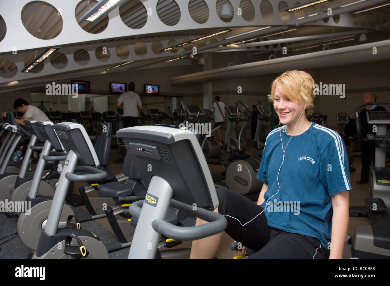 Woman on exercise bike fitness gymnasium Haverfordwest Sports