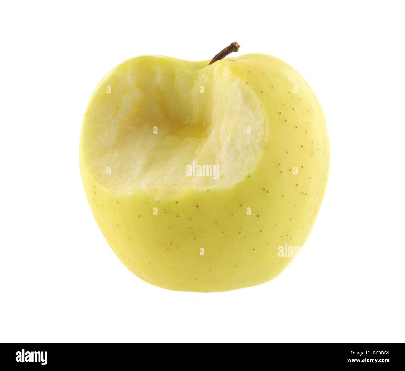 Golden delicious apple with one bite Stock Photo