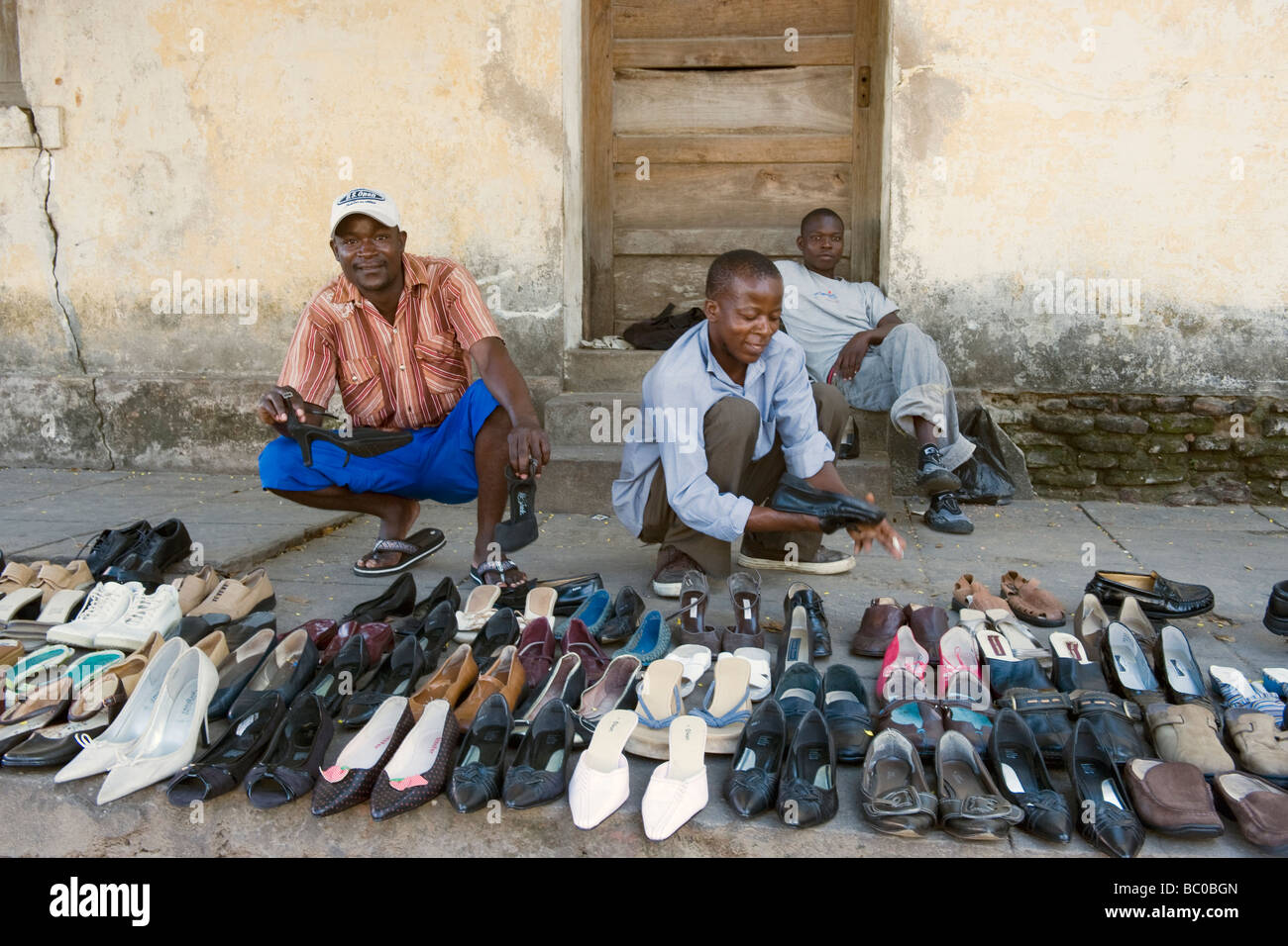 Street hawkers selling shoes Quelimane Mozambique Stock Photo - Alamy
