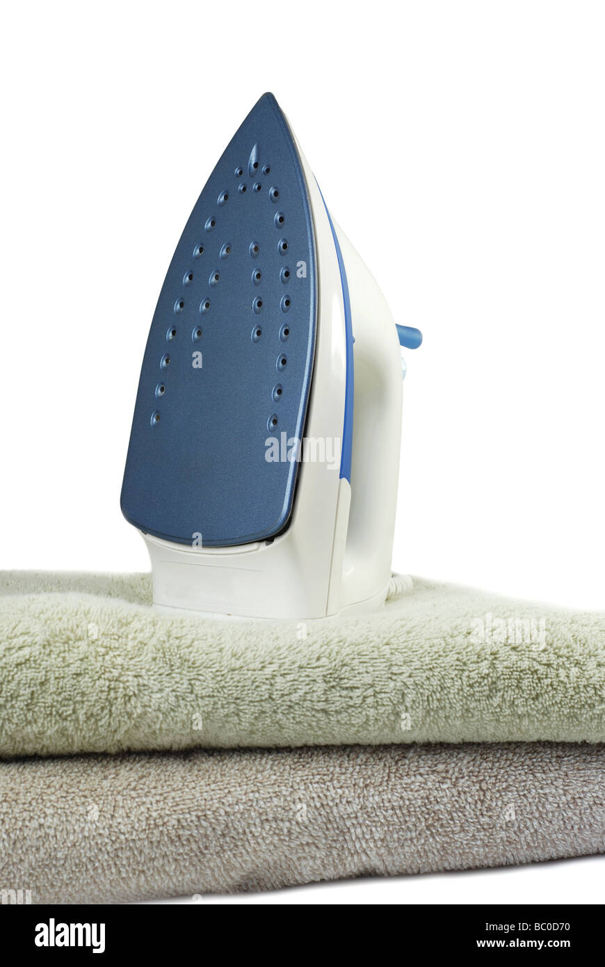 Electric iron on towels Stock Photo Alamy