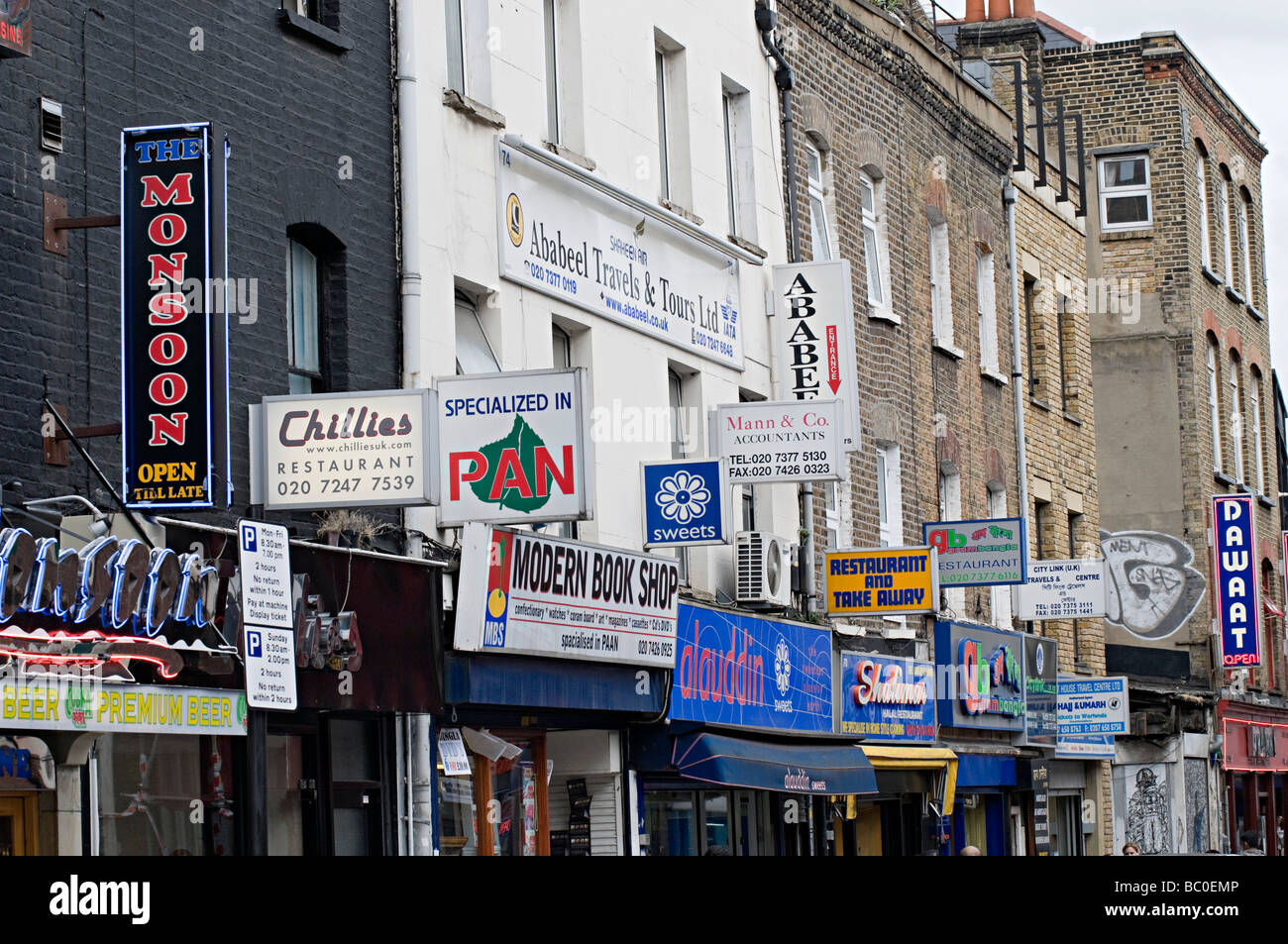 famous curry restaurant signs down brick lane in the east end of london