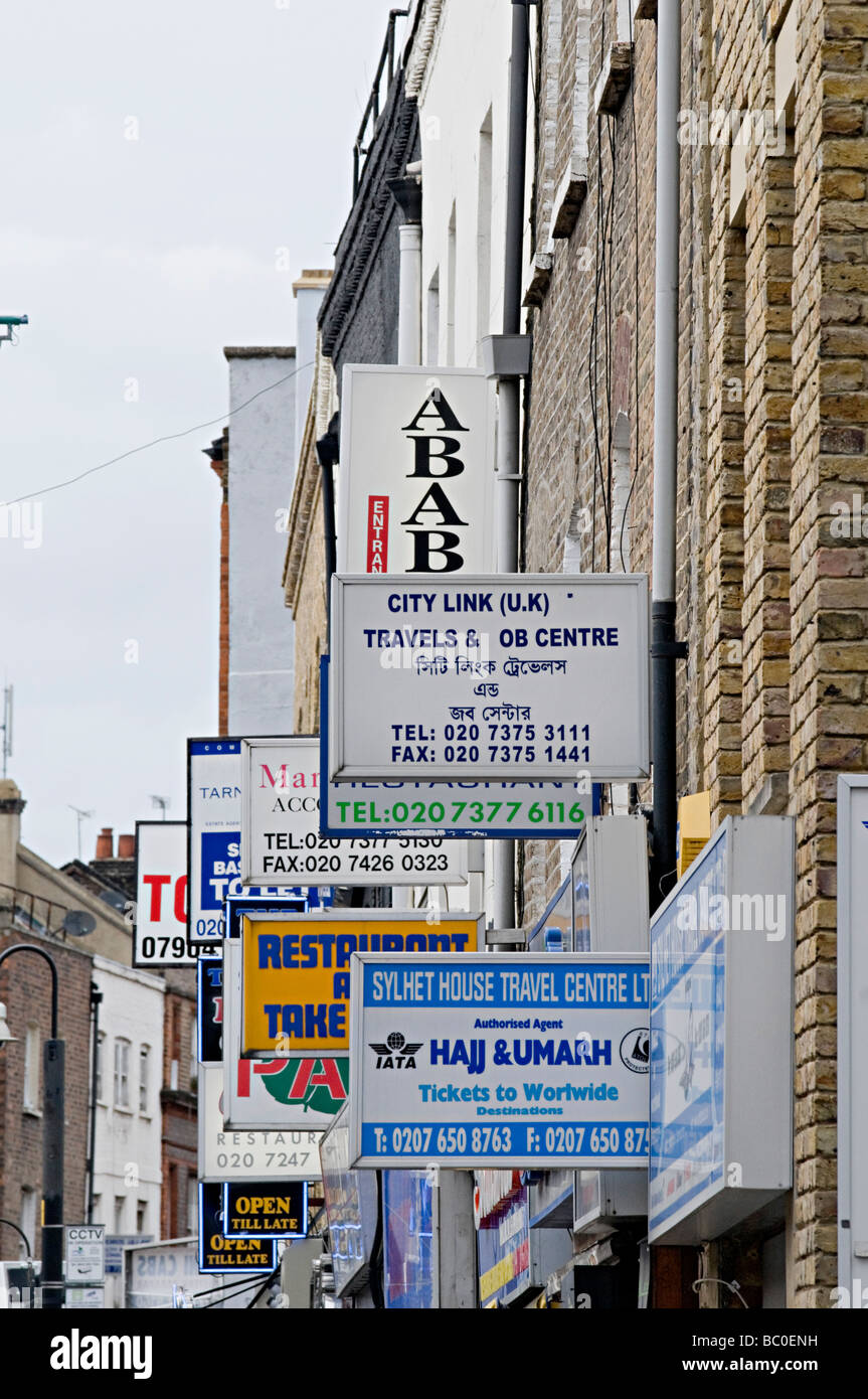 famous curry restaurant signs down brick lane in the east end of london