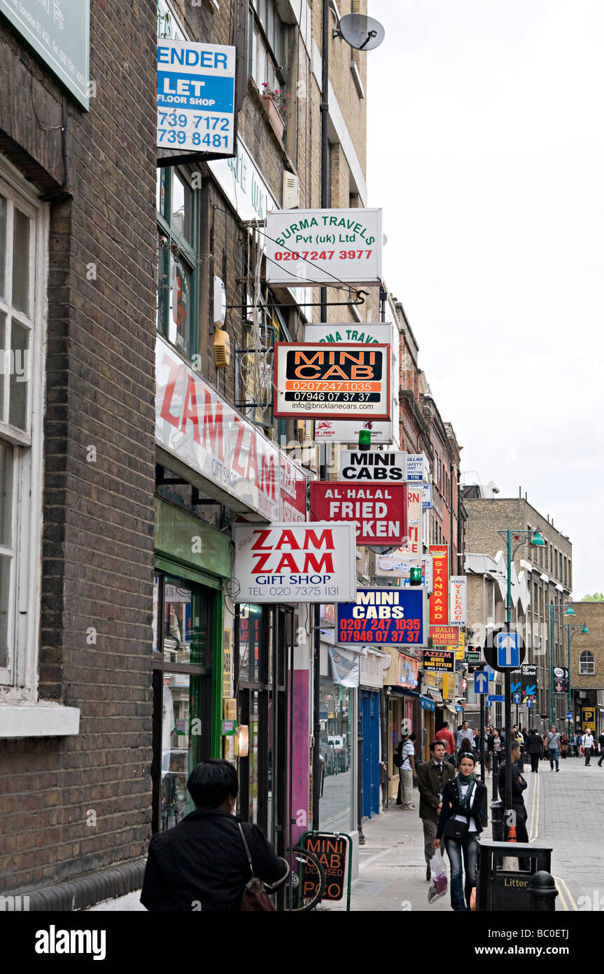 famous curry restaurant signs down brick lane in the east end of london